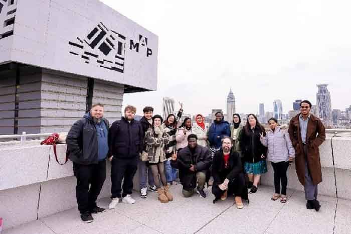 Online novelists from various countries pose for a picture during the third Shanghai International Online Literature Week in Shanghai. 