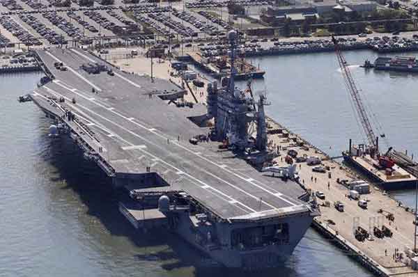 The nuclear powered aircraft carrier USS George Washington sits pier side at Naval Station Norfolk in Norfolk, Va., Wednesday, April 27, 2016.