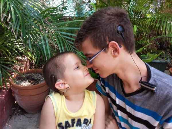 Brothers Javier and Alejandro Valdivia, just two of the more than 500 Cubans with cochlear implants. 