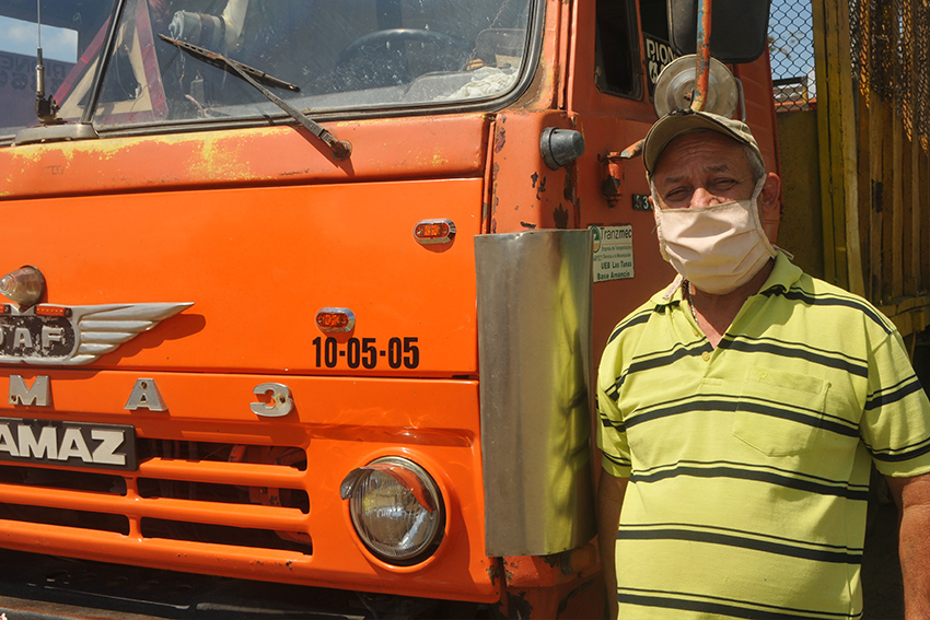 Truck driver Pedro García works tireless taking sugarcane to the Majibacoa mill