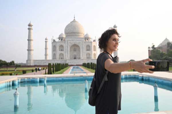 A tourist from Brazil at the Taj Mahal after it reopened to visitors following the easing of coronavirus restrictions in Agra.  Photo: Money Sharma / AFP
